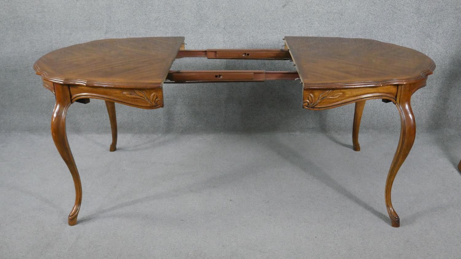 A French Provincial style walnut extending dining table with quarter veneered top and extra leaf - Image 5 of 7