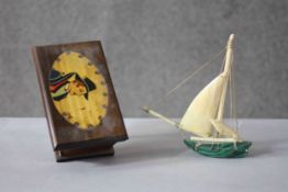 A 19th century carved malachite sail boat with bone sails along with a painted jewellery box. H.6
