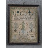 A framed and glazed Victorian hand embroidered sampler by Anne Robinson at the age of ten.