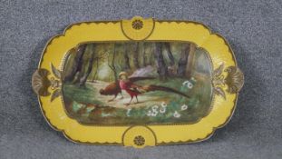 A large hand painted Haviland and Nathan Dohrman & Co porcelain platter. Decorated with a yellow and