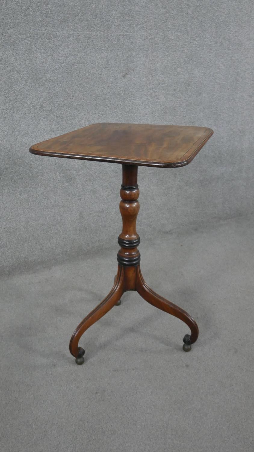 A 19th century mahogany tilt top table on turned column and tripod scrolling supports resting on - Image 2 of 8
