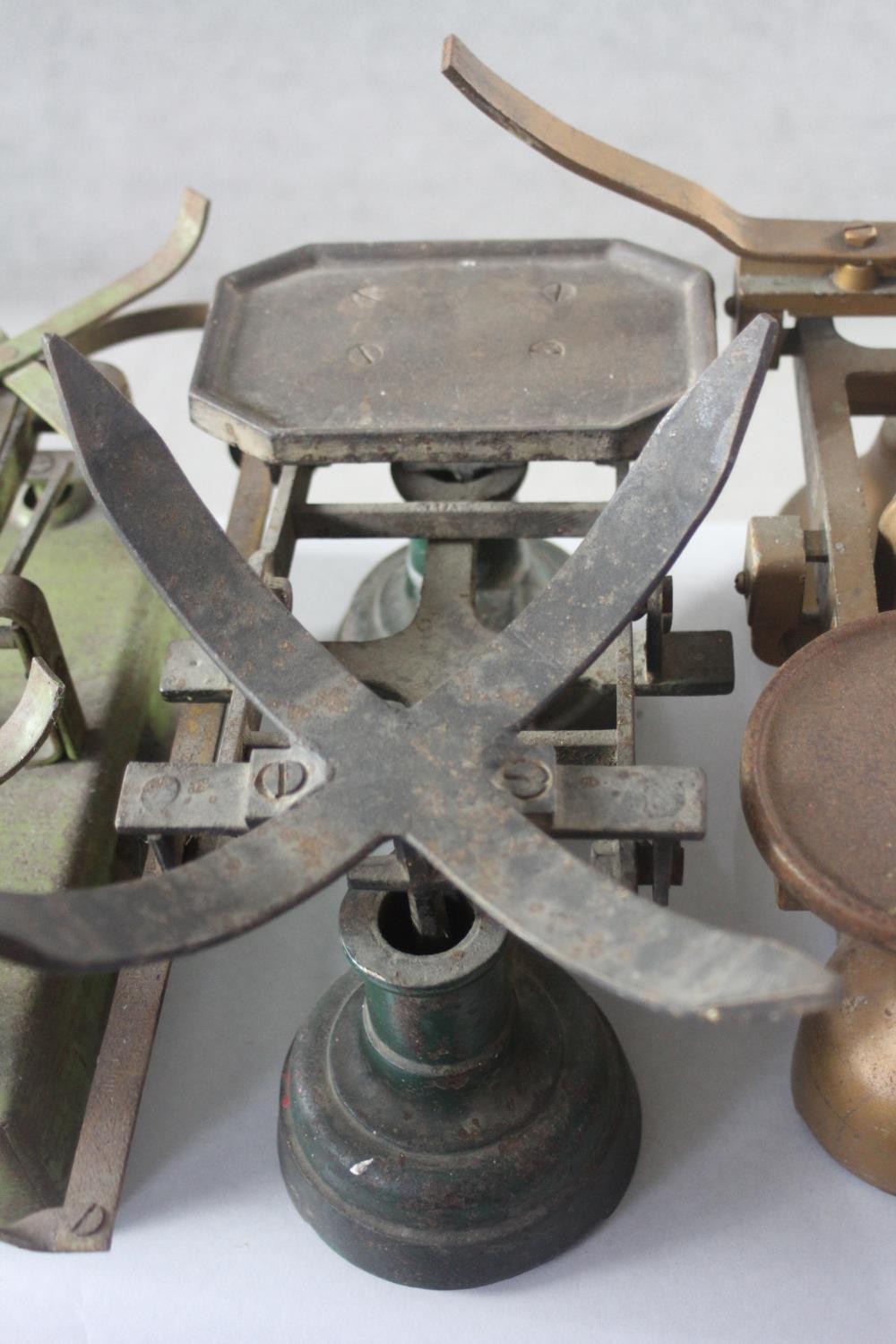 A collection of five sets of vintage painted cast iron shop scales. H.29 W.55 D.27cm. - Image 4 of 6