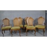 A set of six French Provincial style carved walnut dining chairs with caned back and upholstered