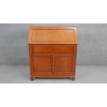 A contemporary Chinese hardwood bureau with fitted interior. H.109 W.90 D.44cm