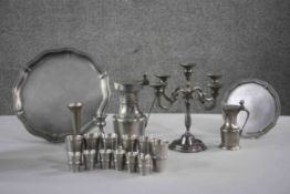 A large collection of pewter. Including a set of twelve Finish shot glasses, two different sizes