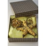 A gold plated Danish Flora Danica starfish brooch along with a gold plated sprig of parsley with