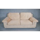 A contemporary two seat sofa in faux suede upholstery. H. 90 W. 205 D. 100