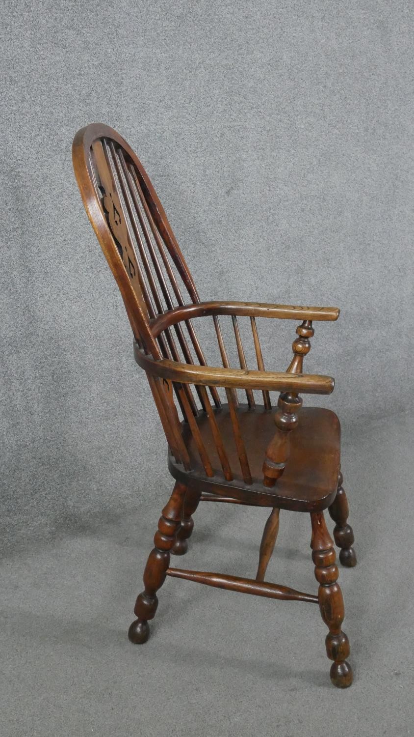 A 19th century elm Windsor armchair with pierced and carved central splat on turned and - Image 3 of 6