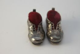 Two miniature novelty Danish silver boot pin cushions. With red velvet cushions. Stamped T.F.925S.