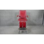 A mid century metal framed articulated physiotherapy chair in faux leather upholstery. H.138 W.72