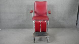 A mid century metal framed articulated physiotherapy chair in faux leather upholstery. H.138 W.72
