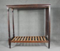 A Georgian mahogany full tester bedstead with turned supports, to take a small single mattress. H.