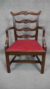 A Georgian mahogany ladder back armchair with drop in seat on square stretchered supports. H.66 W.46