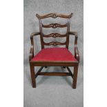 A Georgian mahogany ladder back armchair with drop in seat on square stretchered supports. H.66 W.46