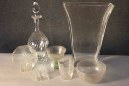A collection of seven glass pieces. Including two Chance glass swirl design plates, a cut glass