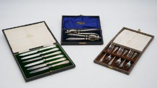 A leather cased set of Mappin and Webb silver plated fruit knives, a leather cased pair of silver