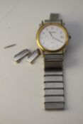 A Bucherer Swiss made bicolour stainless steel gentleman's quartz watch and spare links. The metal