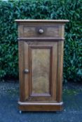 A 19th century Continental figured walnut pot cupboard. H.83 W.45 D.40cm