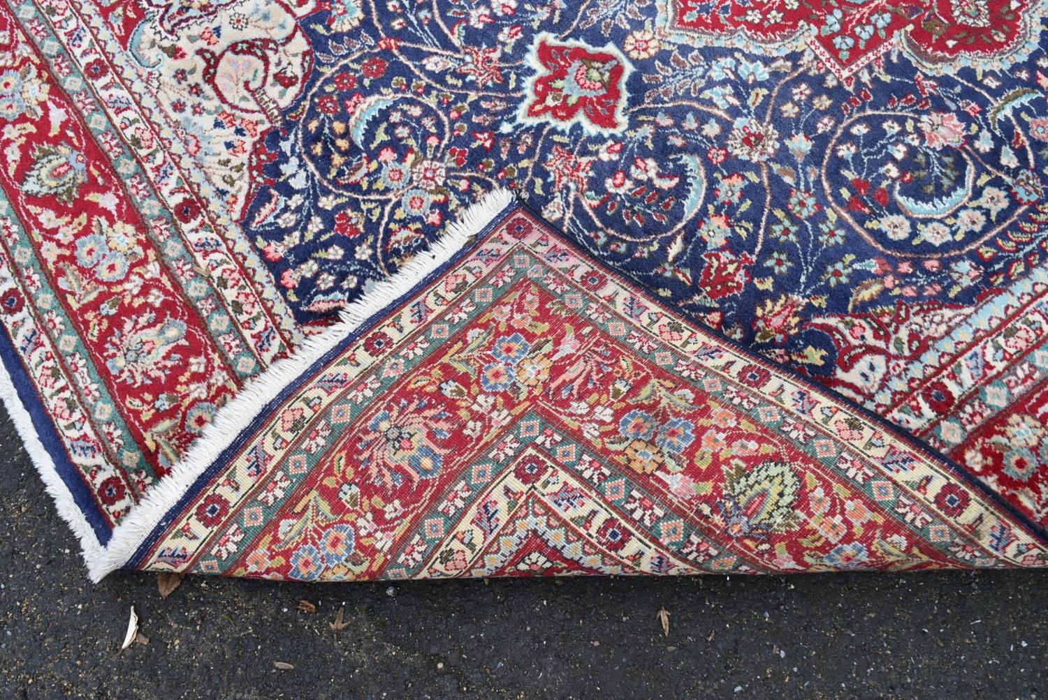 A Persian Keshan carpet with central floral medallion on sapphire ground within foliate multiple - Image 4 of 4