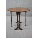 A Victorian mahogany drop flap Sutherland table on turned tapering gateleg supports. H.56 W.54 D.