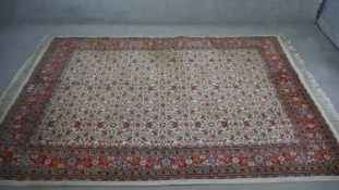 A handmade Persian Moud carpet with cream ground and all over foliate and floral design design.