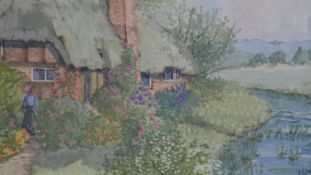 A framed and glazed watercolour of a country cottage by a river. Indistinctly signed. H.34 W.44cm