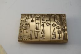 A bronze paperweight. A reproduction of a foundation tablet of the temple of the goddess Nanshé,