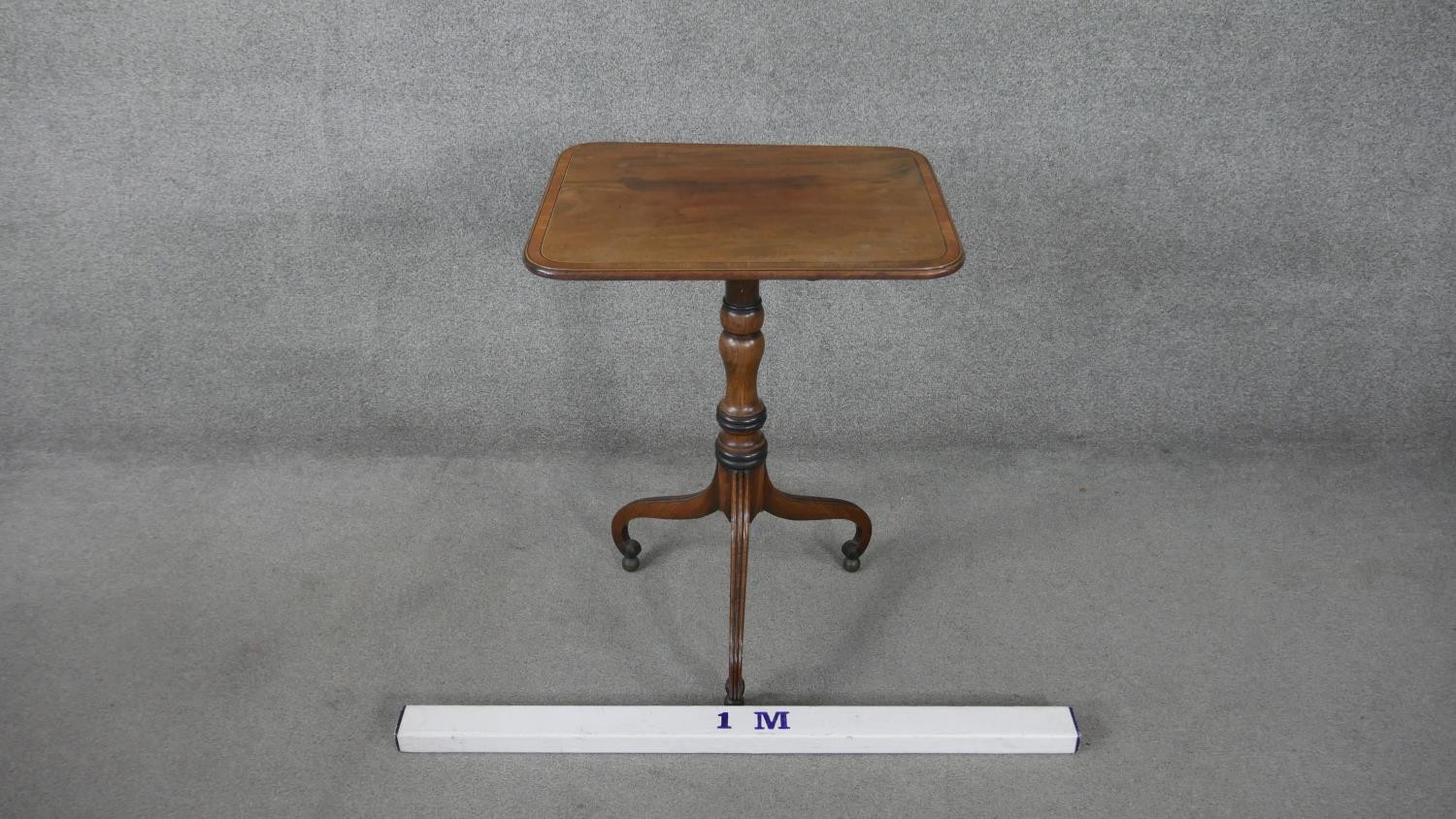 A 19th century mahogany tilt top table on turned column and tripod scrolling supports resting on - Image 6 of 8