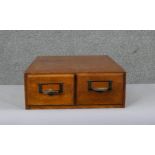 A vintage oak two drawer table top filing cabinet. H.13 W.35 D.39cm
