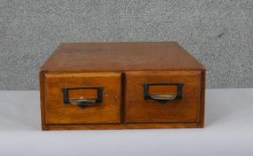A vintage oak two drawer table top filing cabinet. H.13 W.35 D.39cm