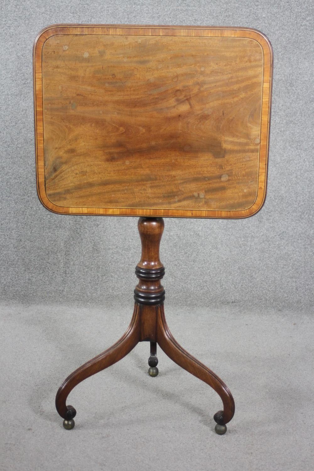 A 19th century mahogany tilt top table on turned column and tripod scrolling supports resting on - Image 7 of 8