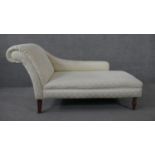 A Victorian style chaise in floral damask upholstery on turned baluster supports. H.80 W.142 D.66cm