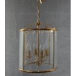 A Victorian style brass and glass circular four branch lantern. Diam.32cm