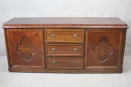 A mid century French walnut sideboard with satinwood and ebony starburst inlay. H.94 W.210 D.62 cm.