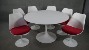 A 1960's vintage Eero Saarinen design 'Tulip' table and the matching set of six swivel dining chairs