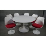 A 1960's vintage Eero Saarinen design 'Tulip' table and the matching set of six swivel dining chairs