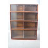 A mid century vintage teak Simplex four section bookcase with sliding plate glass doors. H.163 W.123
