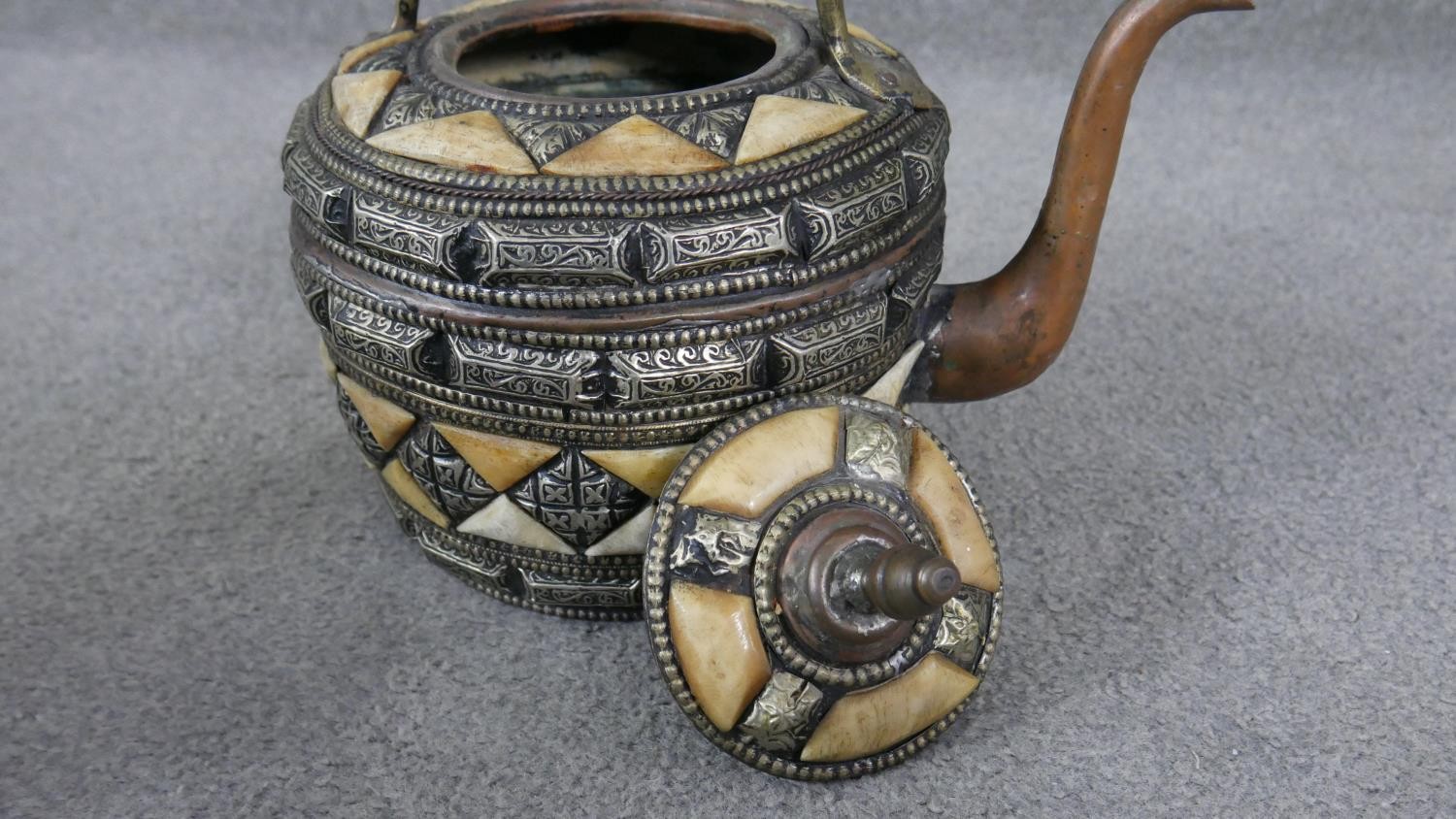 A Moroccan copper, bone and white metal kettle with geometric design. (leaks) H.30 W.28cm - Image 3 of 5