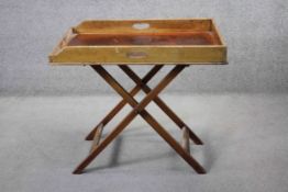A 19th century mahogany butler's tray on folding stand. H.80 W.86 D.61 cm