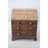 An 18th century country oak bureau with fitted interior on bracket feet. H.95 W.77 D.54 cm.