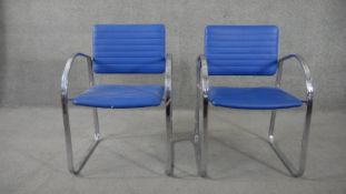 A pair of Zoeftig vintage styled armchairs on chrome bases.