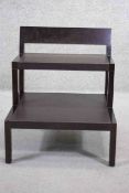A set of mahogany library steps inset with leather. H.65 x W.56 x D. 59 cm