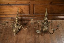 Two 20th century Dutch brass chandeliers with six scrolling branches mounted with sconce holders.
