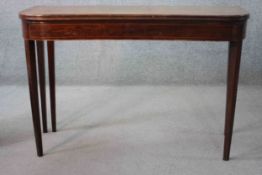 A 19th century mahogany and satinwood strung foldover top tea table on square tapering gateleg