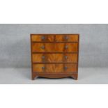 A small Georgian style flame mahogany chest of drawers on shaped apron and bracket feet. H.76 W.76