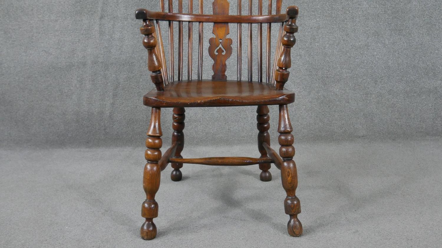 A 19th century elm Windsor armchair with pierced and carved central splat on turned and - Image 6 of 6