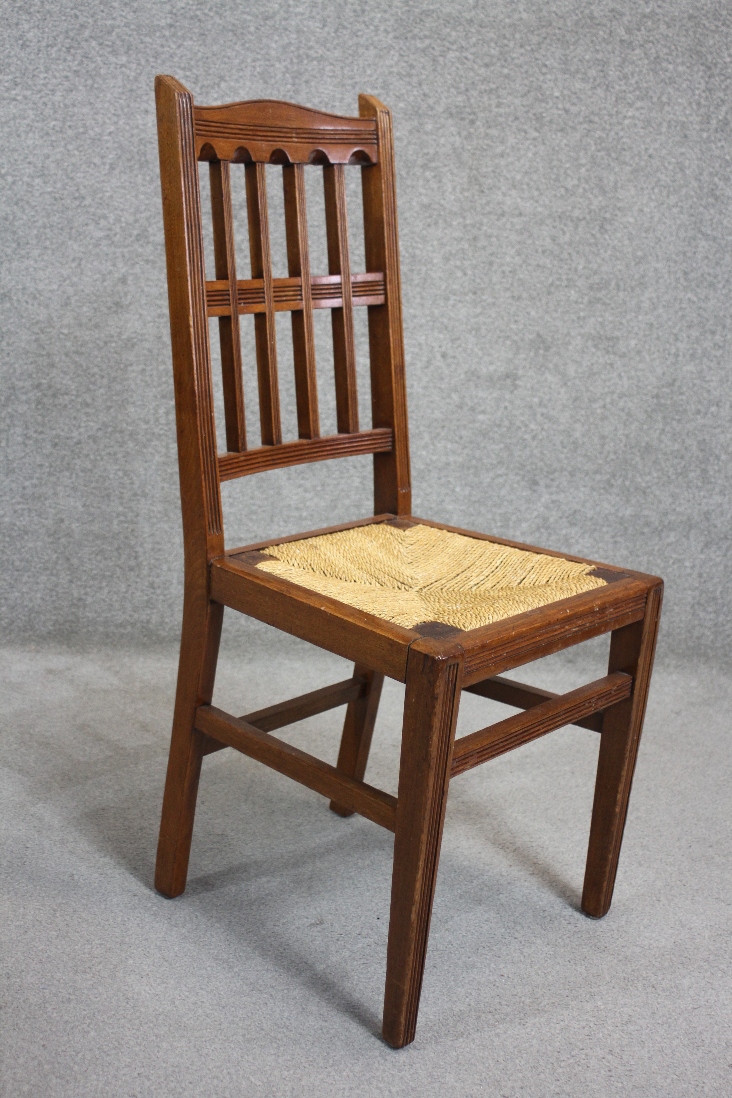 A set of four late 19th century mahogany dining chairs with drop in woven rush seats on square - Image 3 of 4