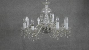 A large vintage cut crystal eight branch chandeliers with hanging crystal drops and swags. H.40 W.