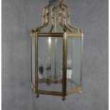 A large Victorian solid brass and glass hexagonal six branch lantern with ridged detailing and brass