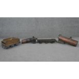 Four handmade copper and iron model steam locomotive parts. Including two boilers, a wagon and